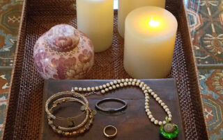 Photo of the urn containing my mum’s ashes along with her jewelry.